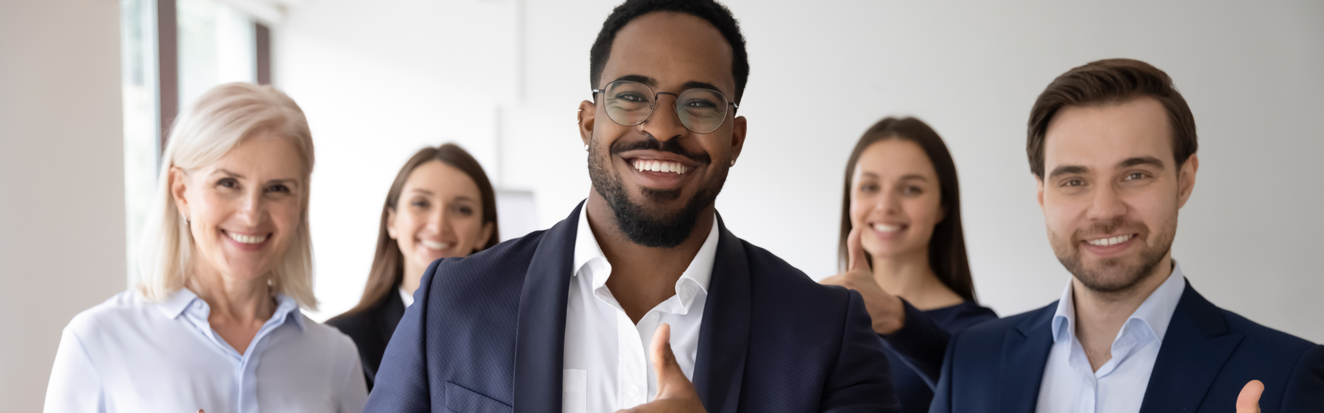men and women smiling